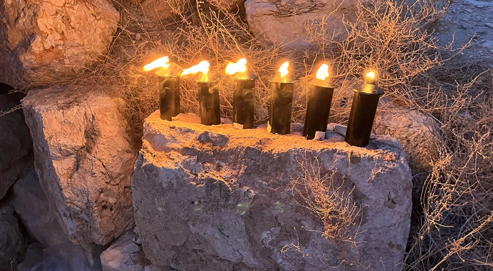 The lighting of the Rosh Chodesh torch of Tevat and the Friday candle